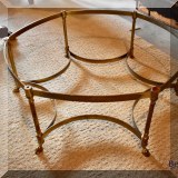 F35. Brass and glass octagonal coffee table with hoof feet. 
